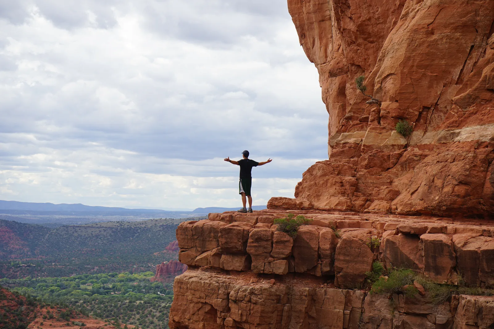 Zach Cohen on a mountain summit