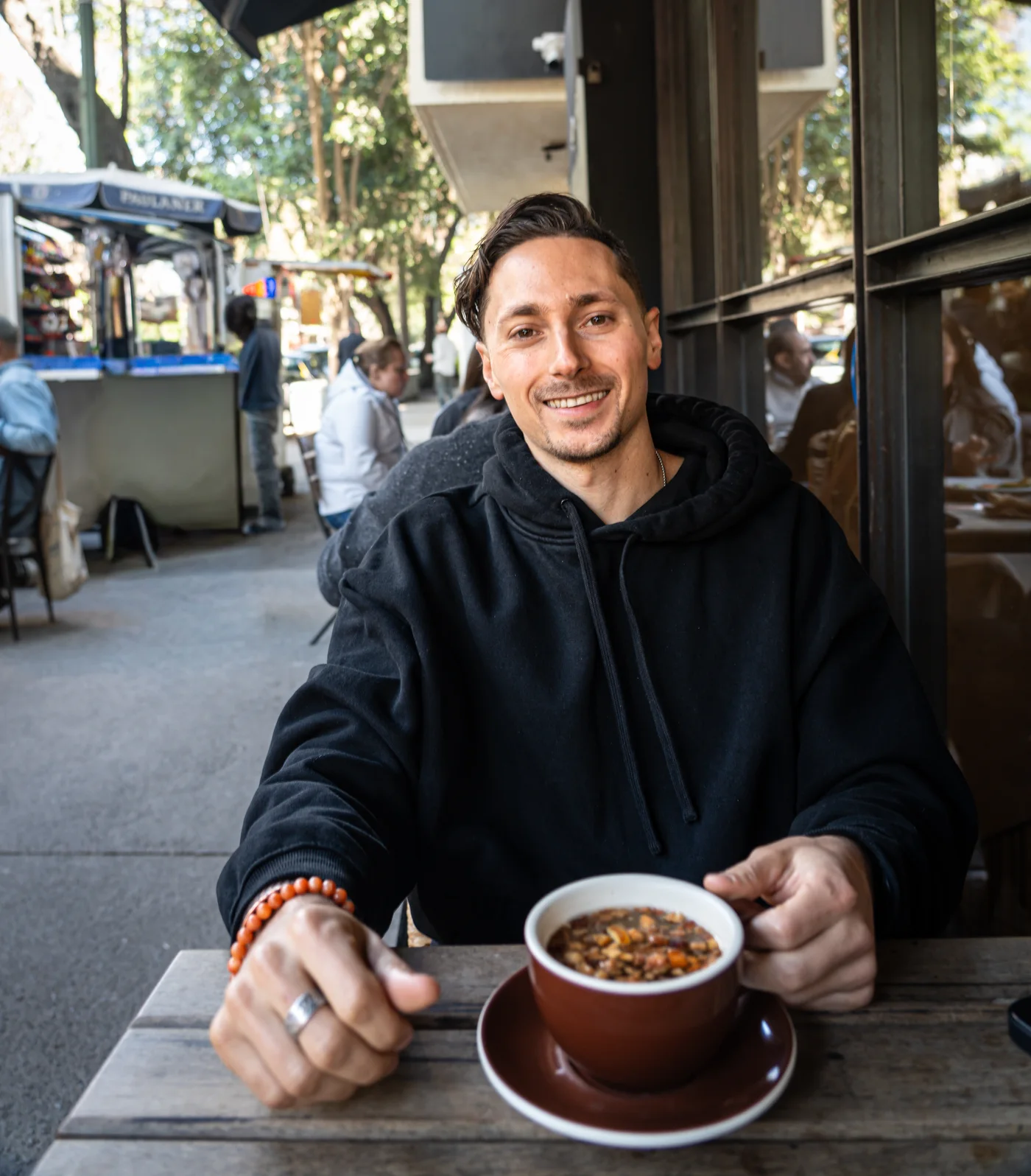 Zach Cohen in a focused one-to-one conversation